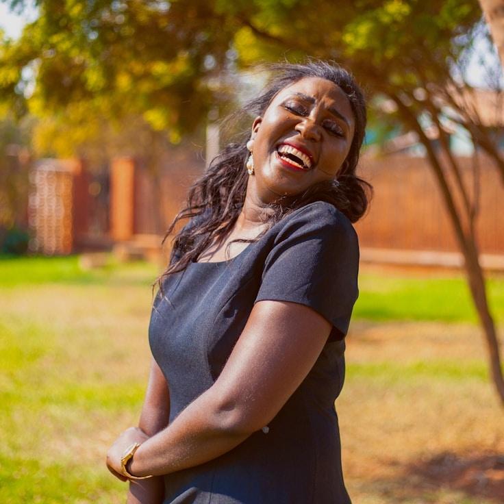 Kaveri Mehta, Lead Design Curator at Primrose & Co., reviewing corporate floral arrangements